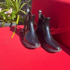 Funky Spring Step black rain boots.